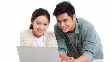 A young couple looking at a laptop photo