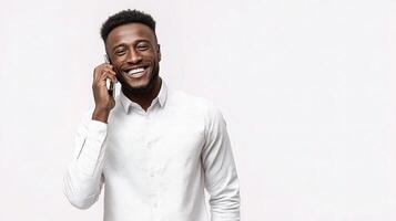 A man in a white shirt talking on his cell phone photo