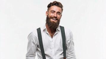 A man with a beard and suspenders is smiling photo