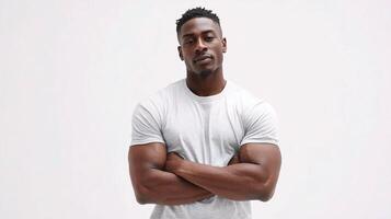 A man with arms crossed standing in front of a white background photo
