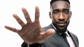 A man in a suit is holding his hand out photo