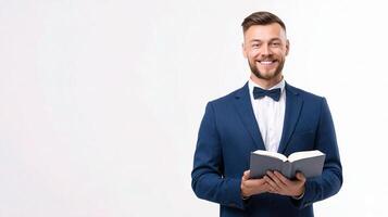 A man in a suit holding an open bible photo