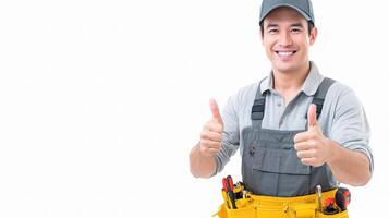 A man in a work uniform holding a tool belt photo