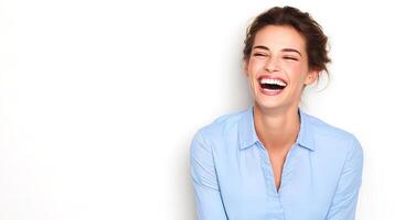 A woman laughing while wearing a blue shirt photo
