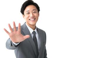 A man in a suit is waving his hand photo