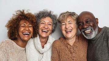 Four older adults laughing together photo