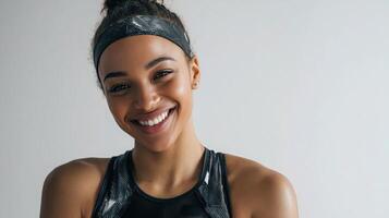 A woman is smiling while wearing a headband photo