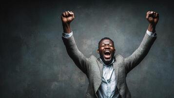 A man is raising his arms in celebration photo