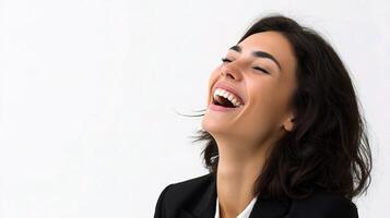 A woman laughing while wearing a suit photo