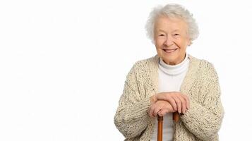 An older woman with a cane is smiling photo