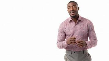 A man in a pink shirt and gray pants is smiling photo