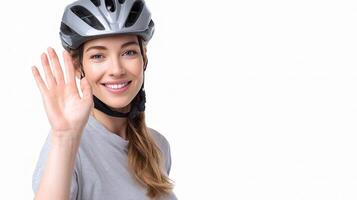 A woman wearing a helmet and holding up her hand photo