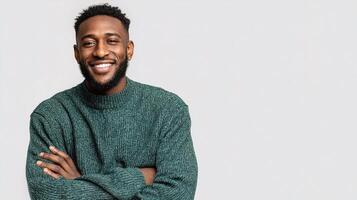 Smiling Man in Green Sweater with Arms Crossed on Neutral Background photo
