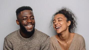 A young couple laughing together photo