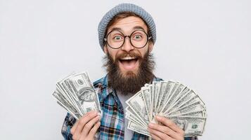 A bearded man with glasses and a hat holding money photo