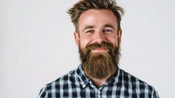 A man with a beard and a checkered shirt photo
