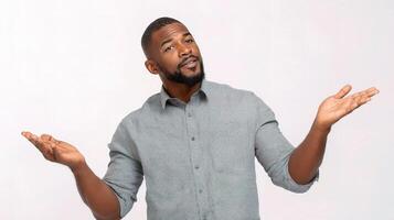 A man with a beard and shirt is standing with his hands out photo