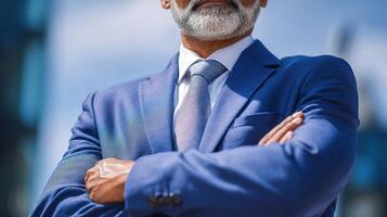 A man with a beard and glasses standing in front of a building photo