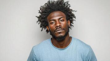 A man with a beard and curly hair photo