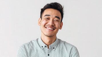 A man is smiling and looking at the camera photo