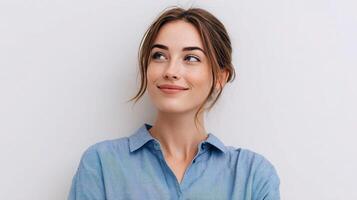 A woman in a blue shirt is looking up photo