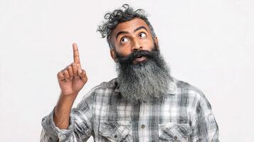 A man with a beard and a shirt is pointing up photo