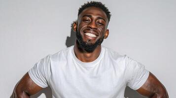 A man with a beard and a white t - shirt photo