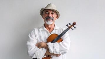 An old man with a hat holding a violin photo
