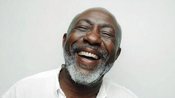 A smiling black man with a white beard photo