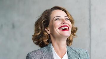 A woman with a red lipstick smiling photo