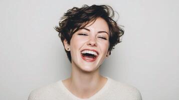 A woman laughing with her mouth open photo