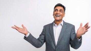 An indian man in a suit and tie is smiling photo