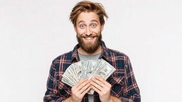 A man with a beard and a plaid shirt is holding money photo