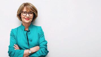 A woman with glasses and a blue blazer photo