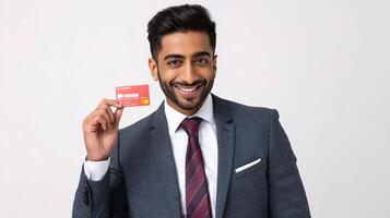A man in a suit holding up a credit card photo