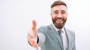 A man with a beard and suit is smiling photo