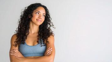 A woman with curly hair and a blue top photo