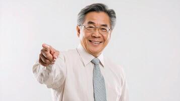 An asian man in a shirt and tie pointing at something photo