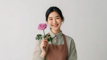 Asian woman holding a rose photo