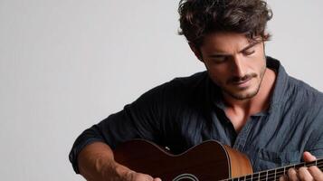 A man with a guitar playing on a white background photo