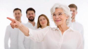 A woman pointing at a group of people photo