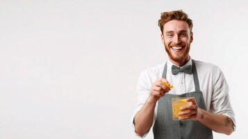 A man in apron holding a glass of orange juice photo