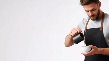 A man in an apron pouring coffee into a cup photo