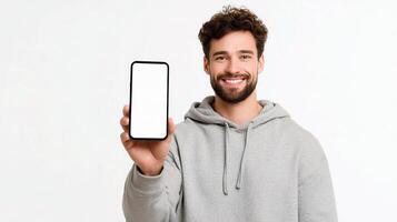 Smiling man holding up blank white phone screen photo