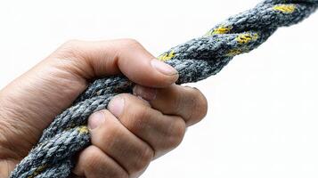 A person holding a rope with a knot on it photo