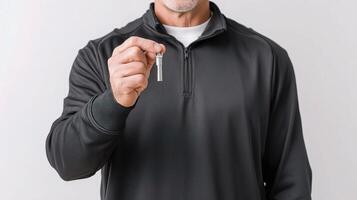 A man holding a key in his hand photo