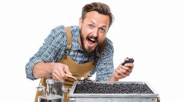 A man is holding a container of blackberries photo