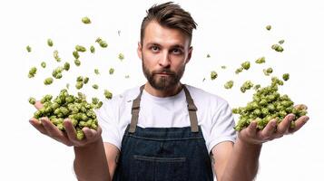 A man holding up a handful of hops photo