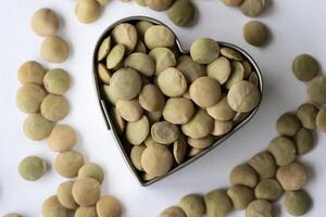 Uncooked Green Lentils in a Heart Shape photo
