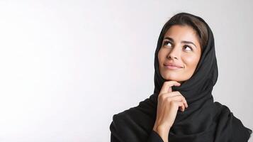 A woman in black headscarf looking up photo